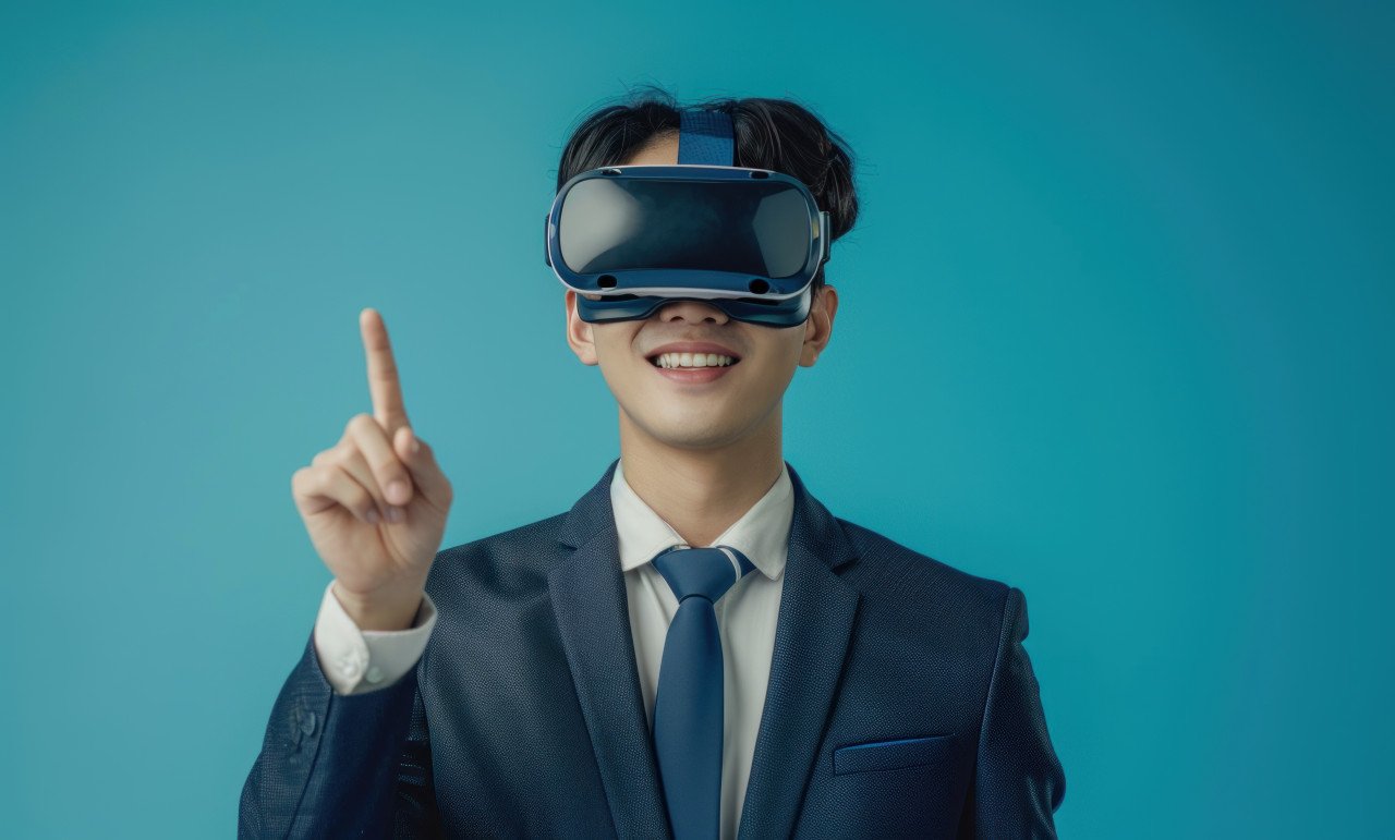 Suited man gestures to vr headset