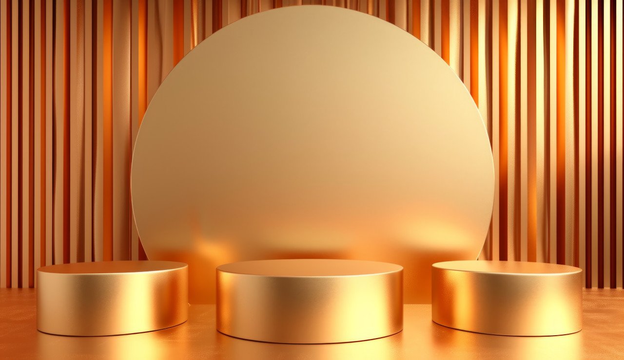 Three golden display podiums set against a golden backdrop