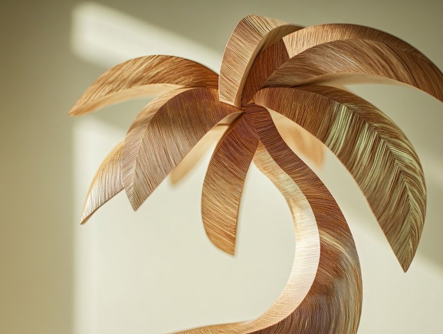 Palm tree bending over ocean waves